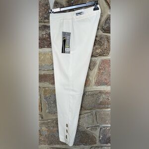 Multiples Slim Sations white stretch pants. Metal Eyelets at ankles add style!